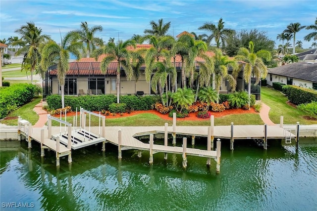 dock area featuring a water view and a yard