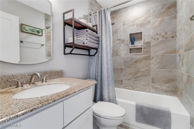 full bathroom with vanity, toilet, and shower / bath combo with shower curtain