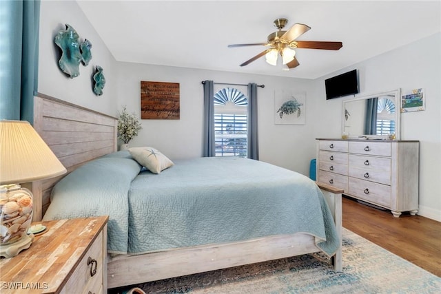 bedroom featuring hardwood / wood-style floors and ceiling fan