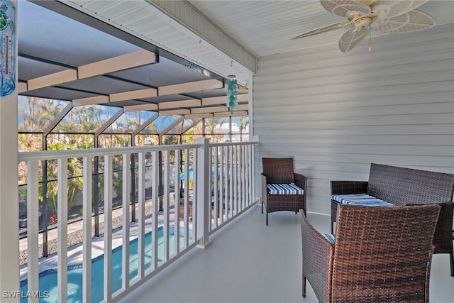 balcony with a patio and ceiling fan