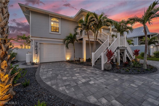 view of front of house with a garage and a porch