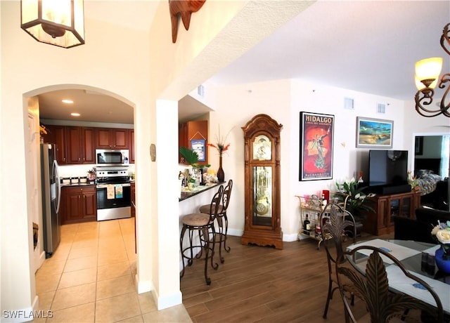 kitchen featuring light hardwood / wood-style floors and stainless steel appliances