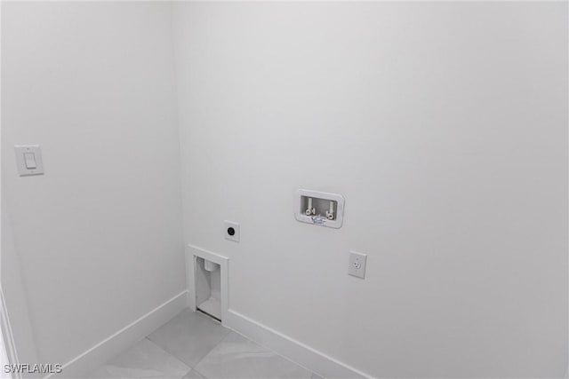 clothes washing area featuring light tile patterned flooring, hookup for an electric dryer, and hookup for a washing machine