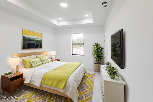 bedroom with a raised ceiling