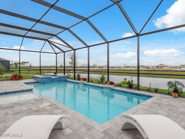 view of pool featuring glass enclosure, a patio area, an in ground hot tub, and a water view