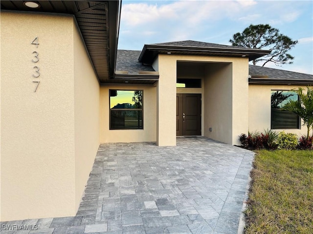 property entrance featuring a patio