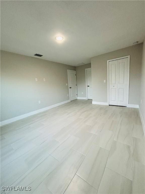 unfurnished bedroom featuring a closet