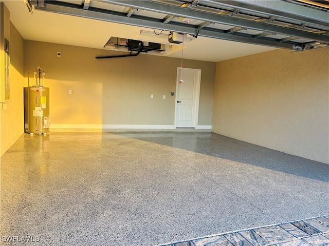 garage featuring water heater and a garage door opener