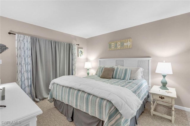 bedroom with light colored carpet