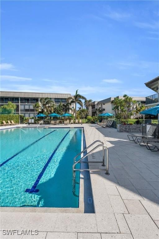 view of swimming pool featuring a patio area