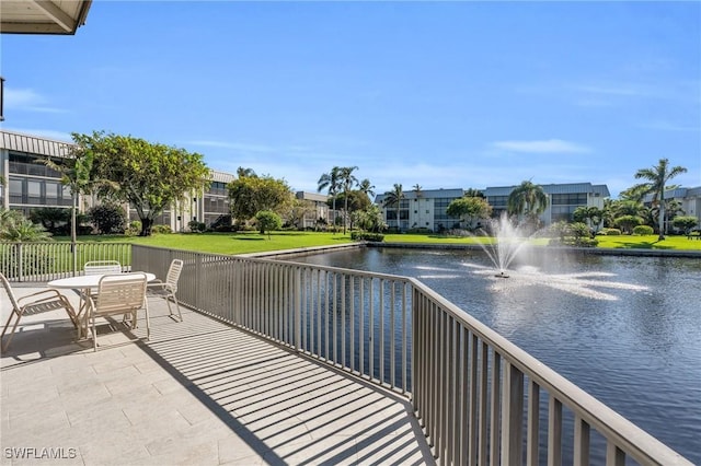 exterior space with a patio area and a water view