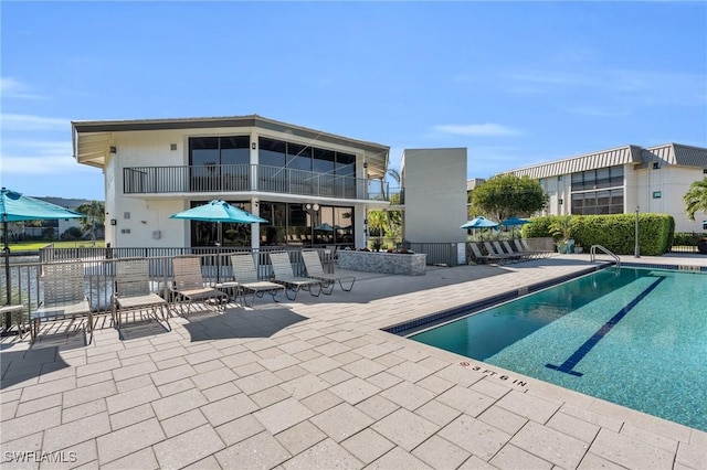 view of pool featuring a patio