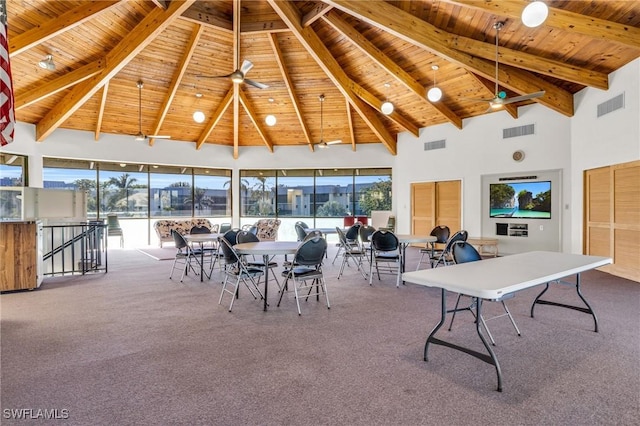 interior space with ceiling fan, lofted ceiling with beams, and wood ceiling