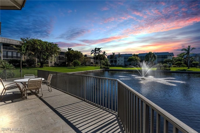 balcony at dusk with a water view