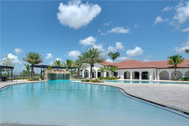 view of pool with a pergola and a patio