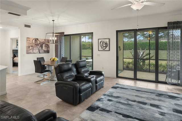 living room featuring ceiling fan with notable chandelier, light tile patterned flooring, and crown molding