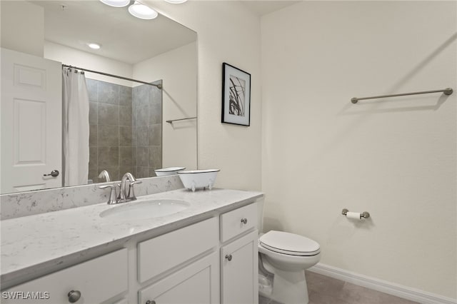 bathroom with vanity, toilet, tile patterned flooring, and walk in shower