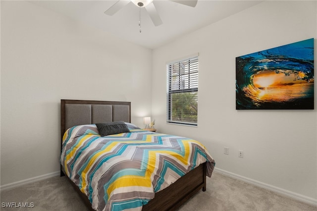 bedroom with ceiling fan and carpet