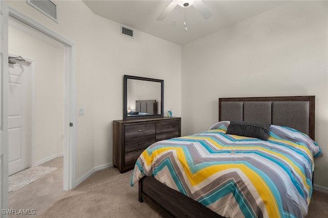 bedroom with ceiling fan and light colored carpet