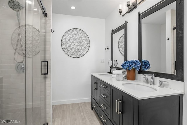 bathroom with vanity and an enclosed shower