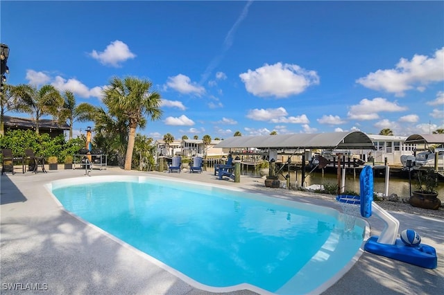 view of pool with a water view