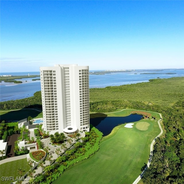 birds eye view of property featuring view of golf course and a water view