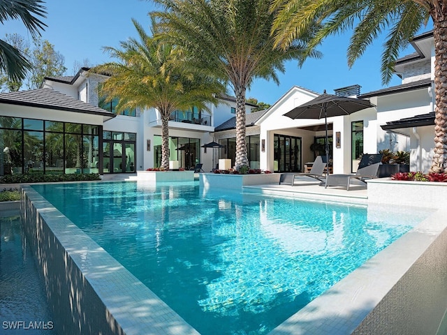 view of swimming pool featuring a patio area