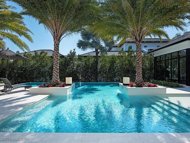 view of pool featuring pool water feature