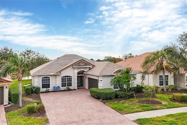 single story home featuring a garage