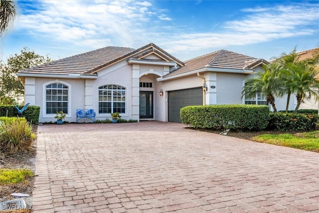 single story home with a garage