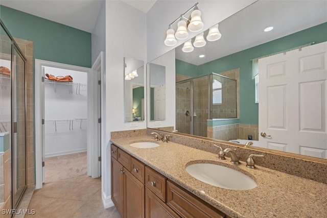 bathroom featuring tile patterned flooring, vanity, and separate shower and tub