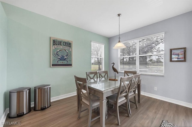 dining area featuring dark hardwood / wood-style floors