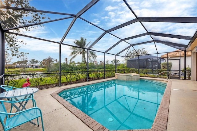 view of pool with an in ground hot tub, a lanai, and a patio