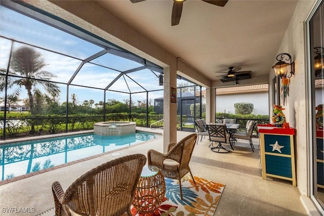 view of swimming pool featuring a lanai, a patio, and an in ground hot tub