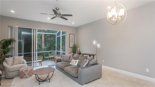 living room featuring ceiling fan with notable chandelier and light tile patterned floors