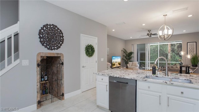 kitchen featuring sink, white cabinetry, dishwasher, light tile patterned flooring, and ceiling fan