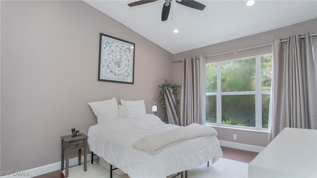 bedroom featuring ceiling fan and vaulted ceiling