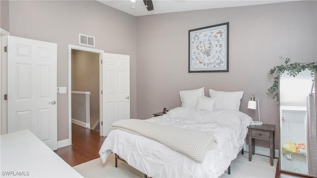 bedroom with ceiling fan and hardwood / wood-style flooring