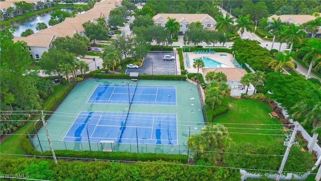 birds eye view of property with a water view