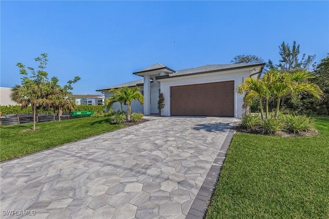 view of front facade with a garage and a front yard