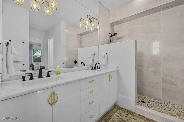 bathroom featuring vanity and a tile shower