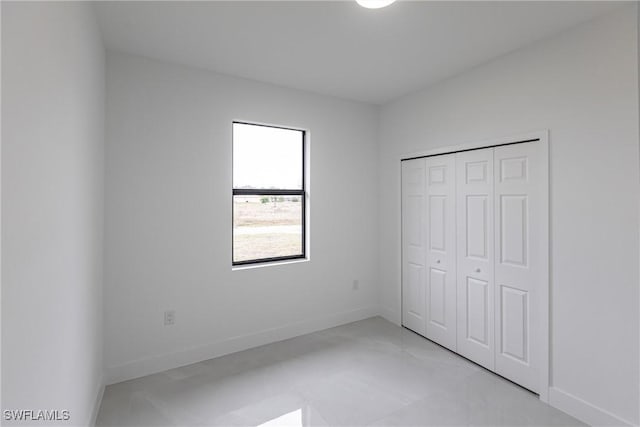 unfurnished bedroom with a closet