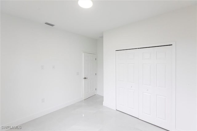 unfurnished bedroom with a closet