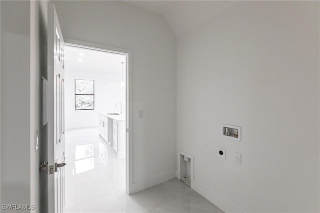 laundry area with washer hookup, sink, hookup for an electric dryer, and light tile patterned flooring