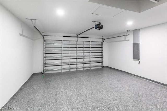 garage with a garage door opener and electric panel