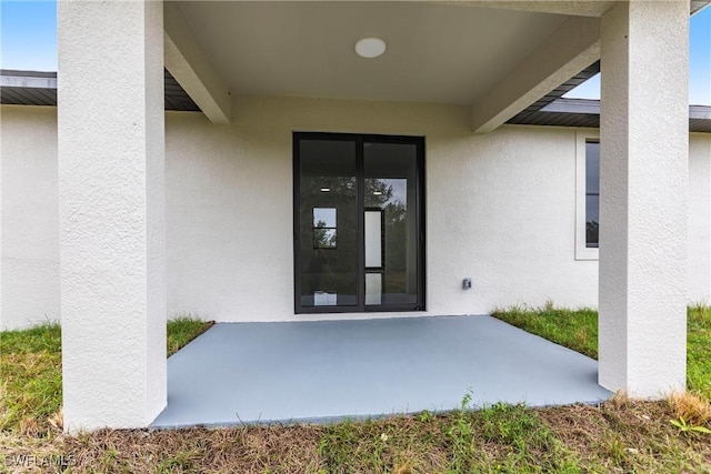 property entrance with a patio area