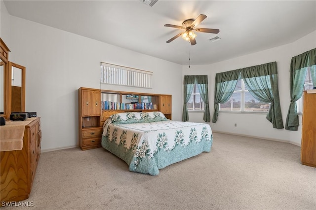 bedroom featuring ceiling fan and light colored carpet