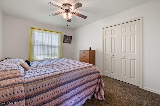 bedroom with ceiling fan, a closet, and dark colored carpet