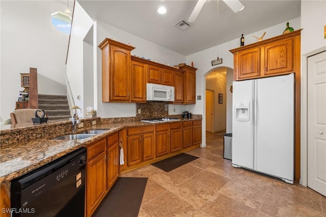 kitchen with ceiling fan, backsplash, white appliances, pendant lighting, and sink