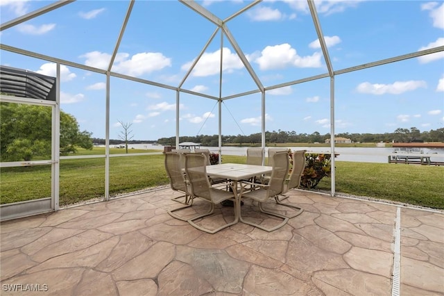 unfurnished sunroom with a water view